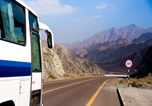 Bus rides on mountain road